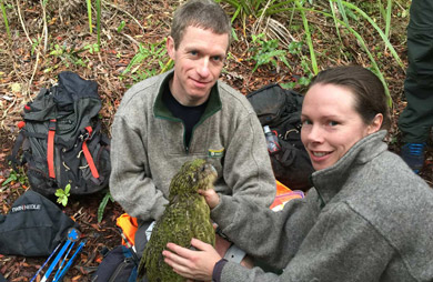 Andrew with Deidre holding kākāpō chick. 