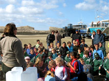 DOC Ranger Amanda Cosgrove gives Tinui and Whareama School children a briefing before they start a beach clean up at Castlepoint Scenic Reserve. Photo: S Burles.