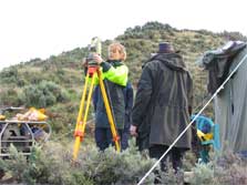 Nadine Bott setting up a theodolite at the lookout during the Cook Strait whale survey. Photo: Simon Childerhouse.