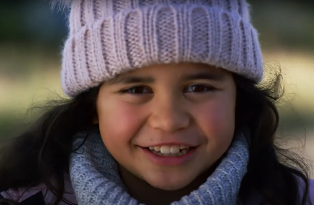 Aotearoa unique biodiversity child in video smiling. 