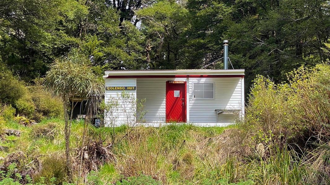 Small single story wooden building.