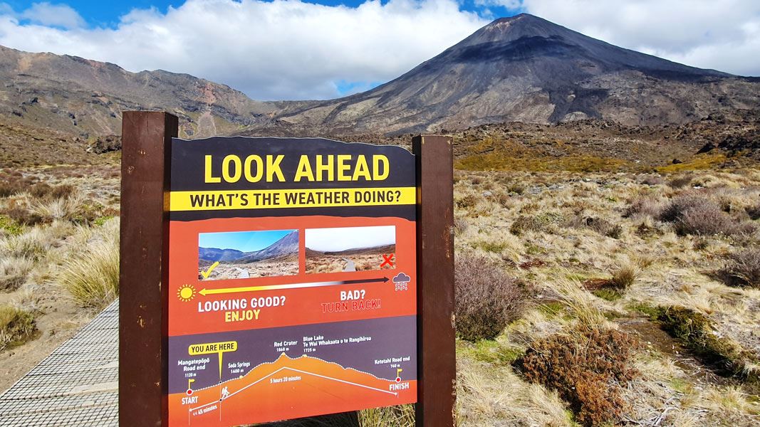 Safety sign with Mt Tongariro in the background. 