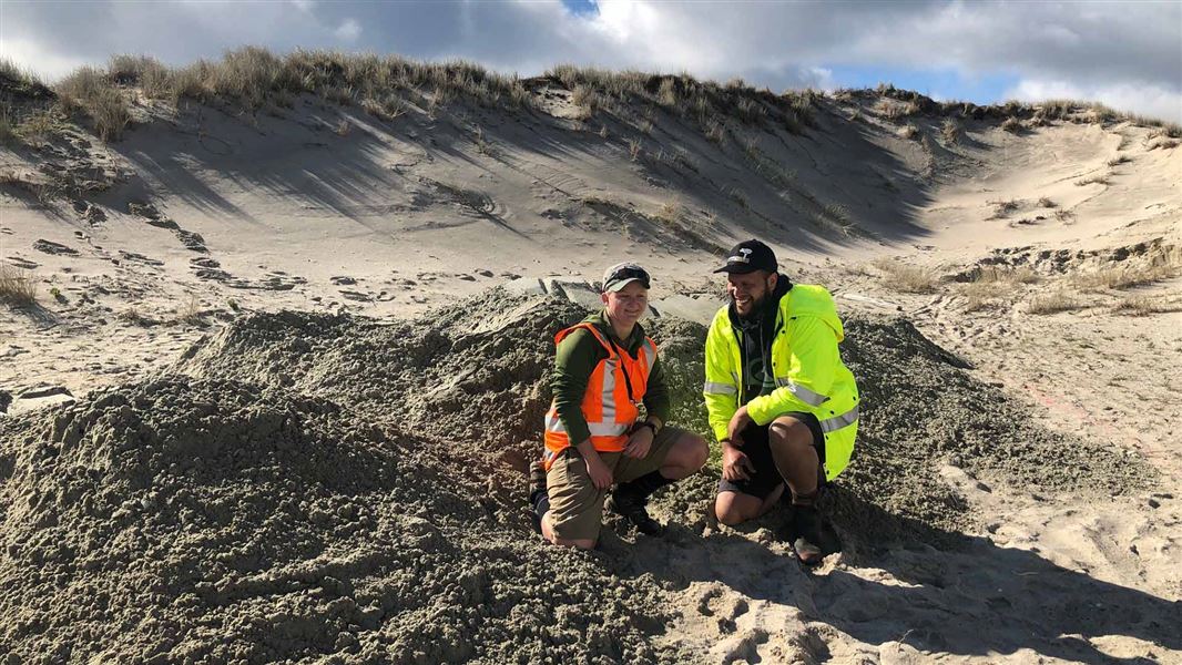 Ayla Wiles (DOC) and Avi Carrington (Patuharakeke) at the new shell nest site in Waipu. 