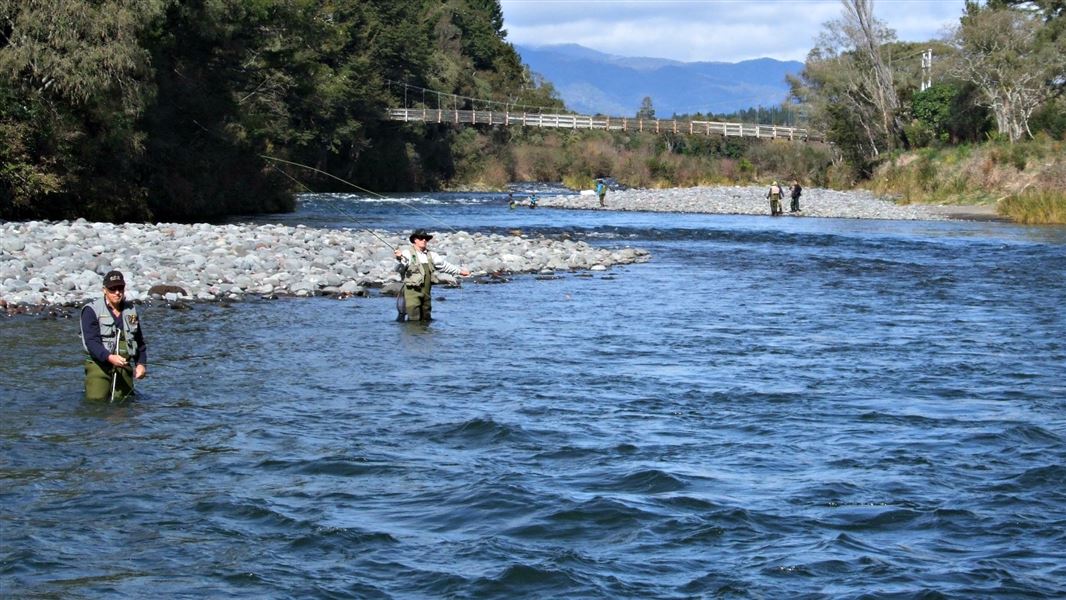 Anglers with the Major Jones footbridge. 