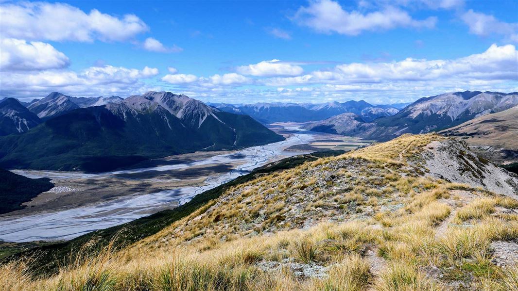 View our over valley with braided river to mountain ranges.