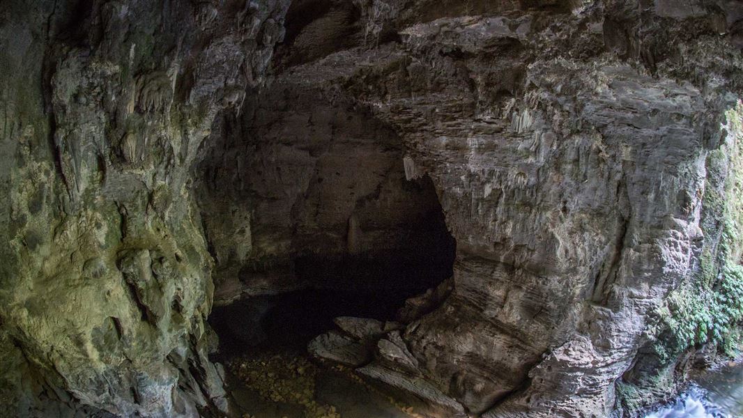 View of the entrance to a large cavern underground