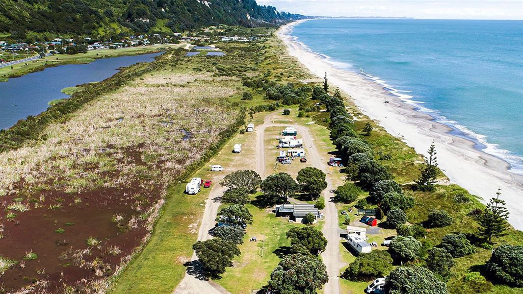 An aerial picture of a campsite set just back from the coast.