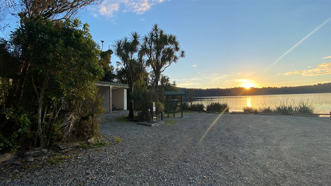 Gravel area near lake.