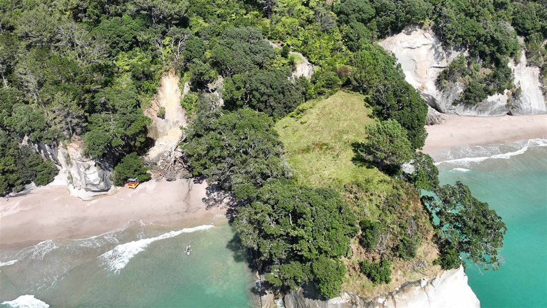 Drone image of Cathedral Cove showing slips, debris and the track slipped away.