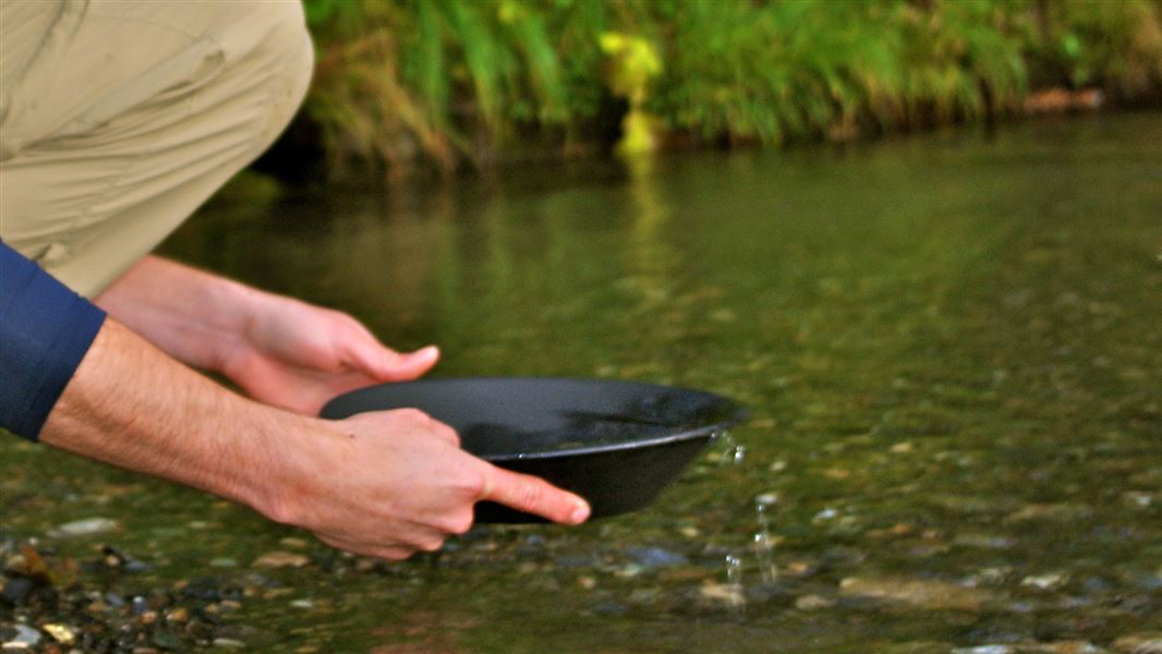 Panning for gold. 