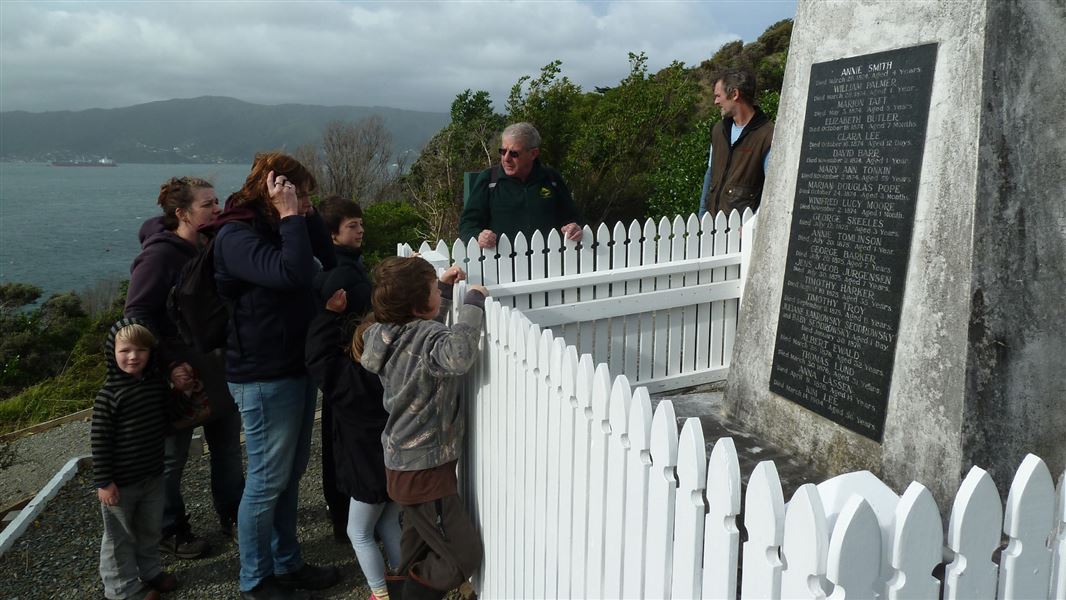 People visiting the memorial cairn. 