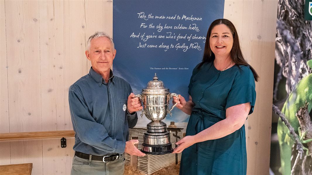 A smiling Mike Harding receiving the Loder Cup from Conservation Minister Willow-Jean Prime at a ceremony in Christchurch.