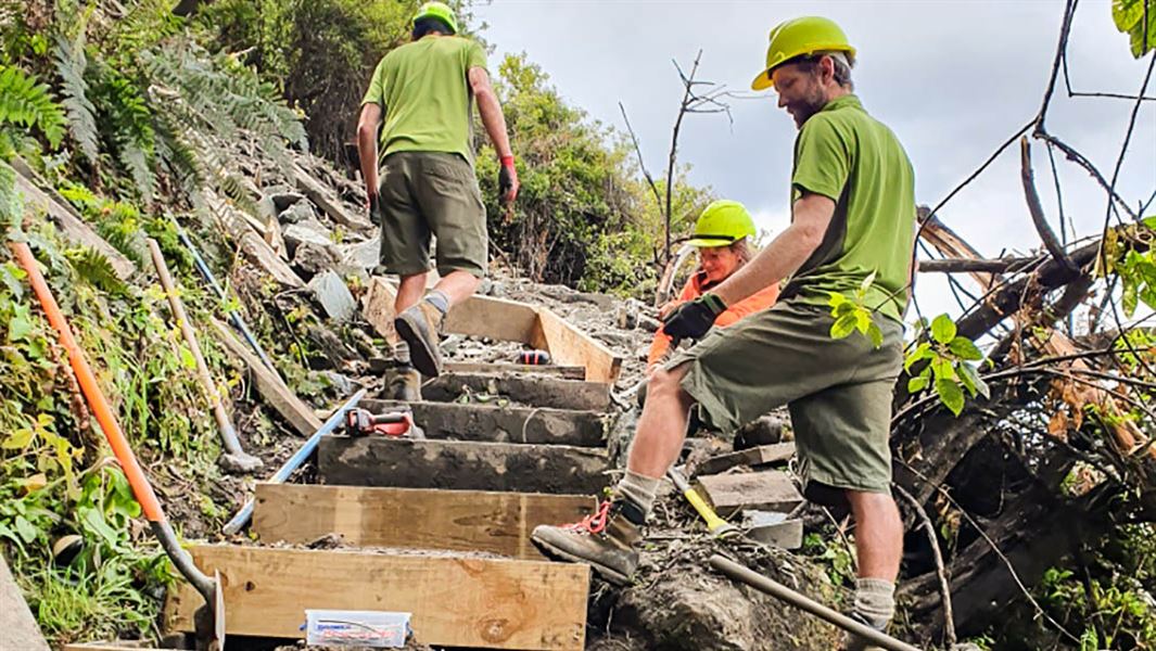 Three DOC employees working on some of the steps of the Diamond Lake track