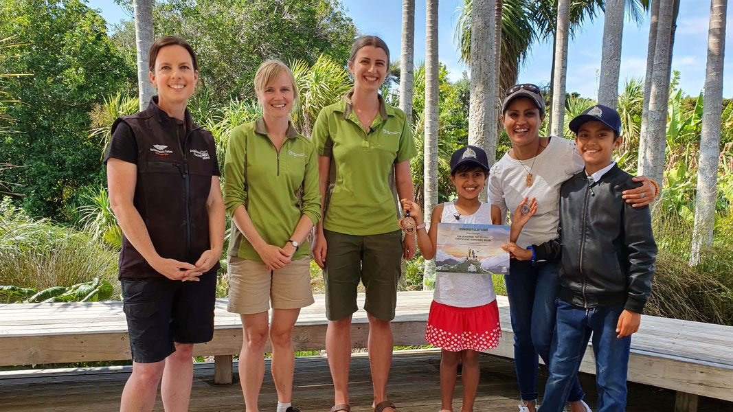 Anya with family and DOC and Auckland Botanic Gardens staff