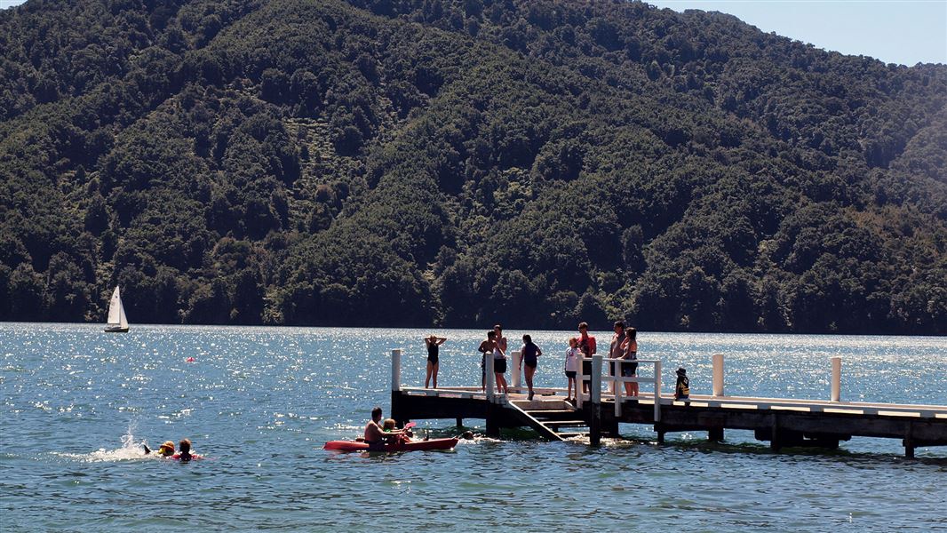 People standing on jetty.