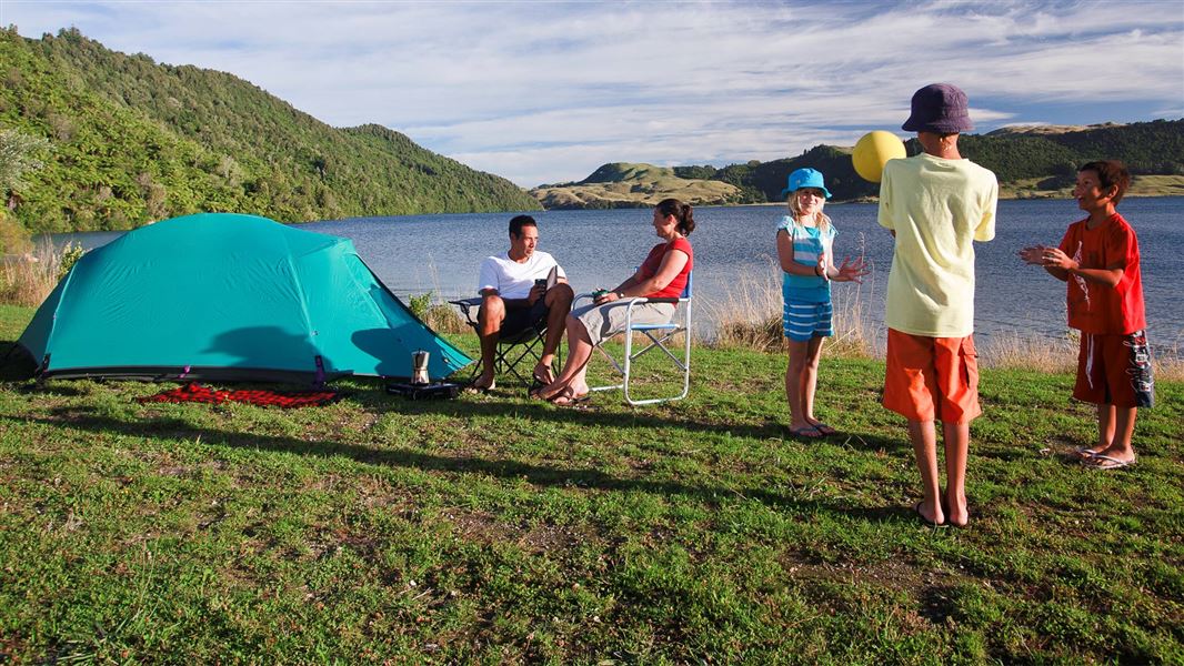 Family at Lake Ōkāreka Campsite