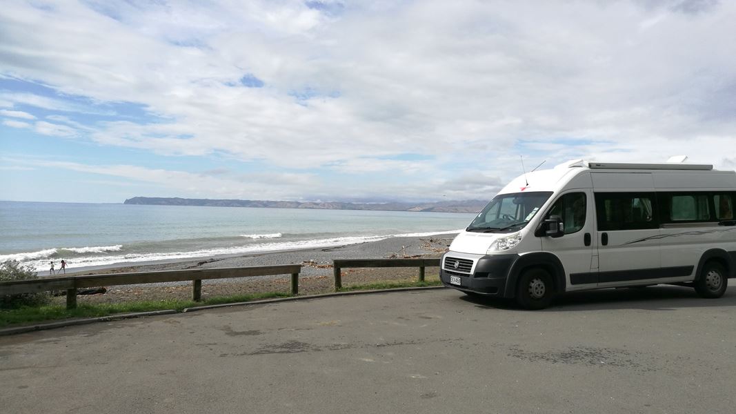 Campervan with Rarangi Beach in the background. 