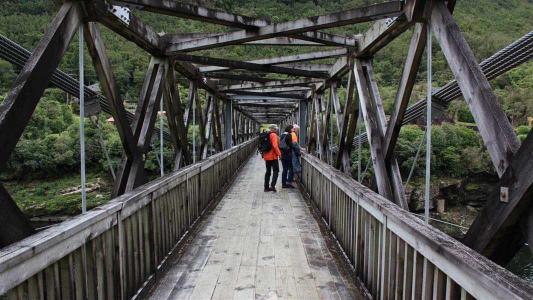 Crossing the Brunner Bridge to the historic mine site. 