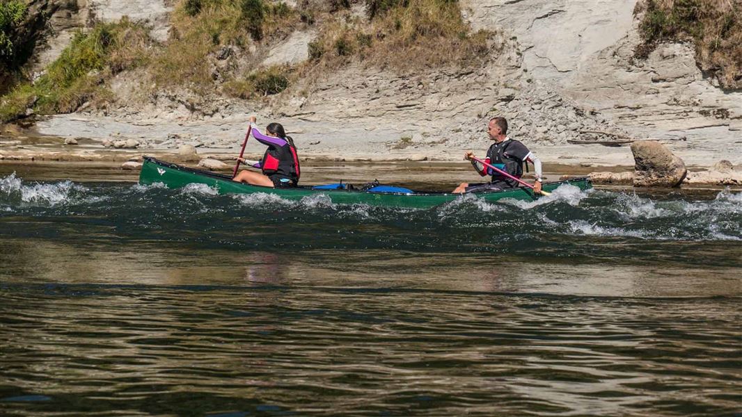 Kayakers paddling the rapids on the Whanganui awa. 